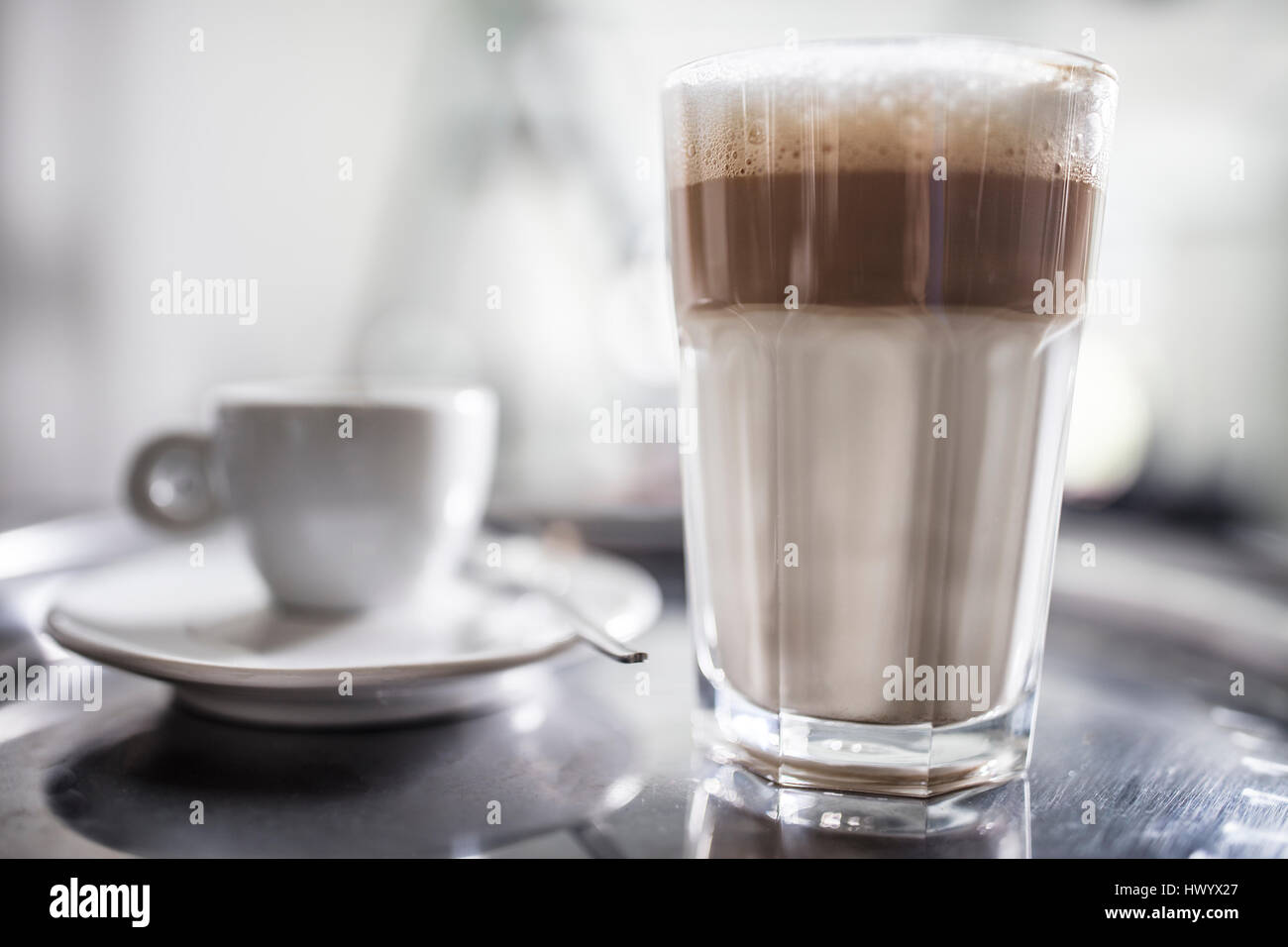 Latte Macchiato and cup on tray Stock Photo