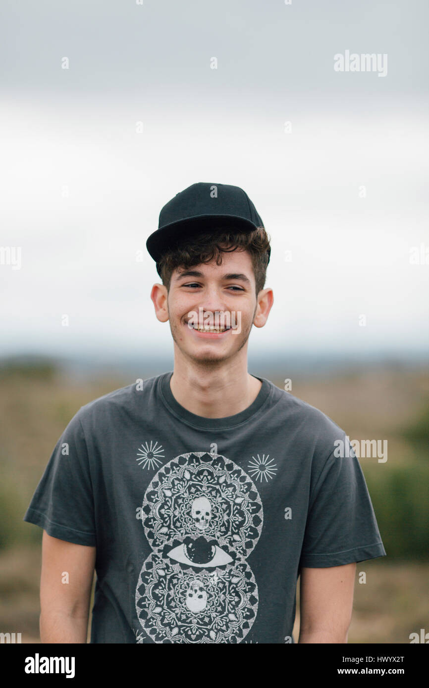 Portrait of smiling young man outdoors Stock Photo - Alamy