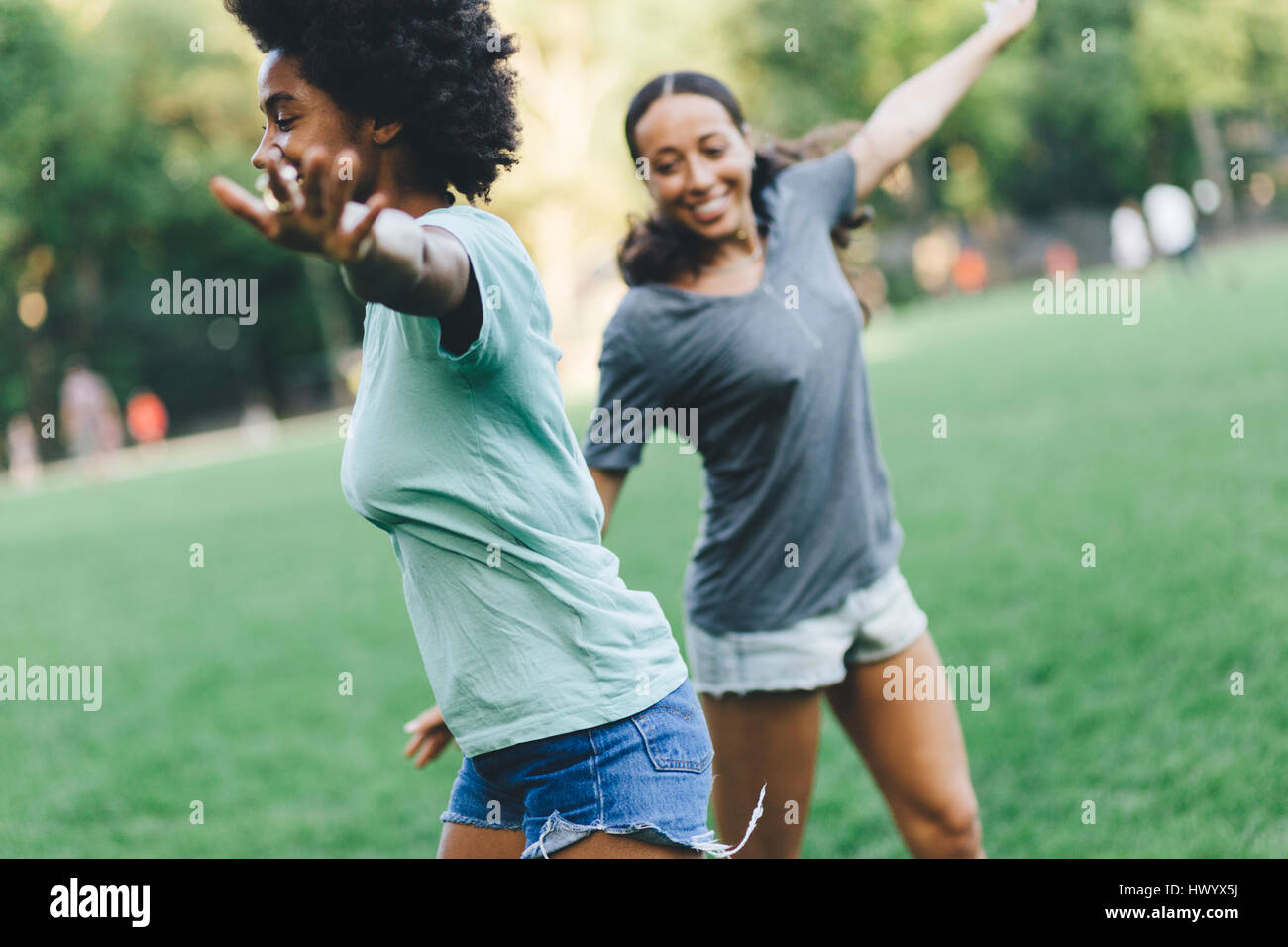 Two best friends having fun together in the park at evening Stock Photo Alamy