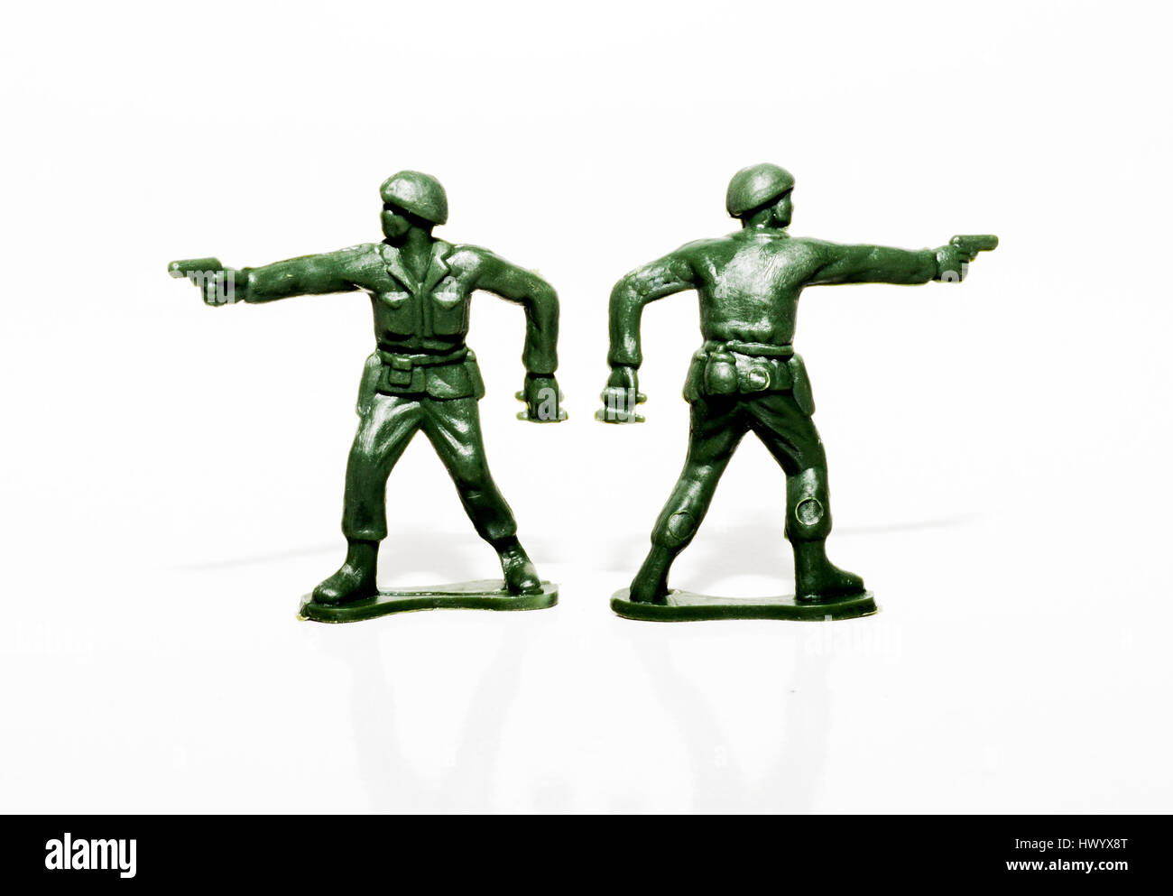 Two plastic green soldiers standing beside each other Stock Photo