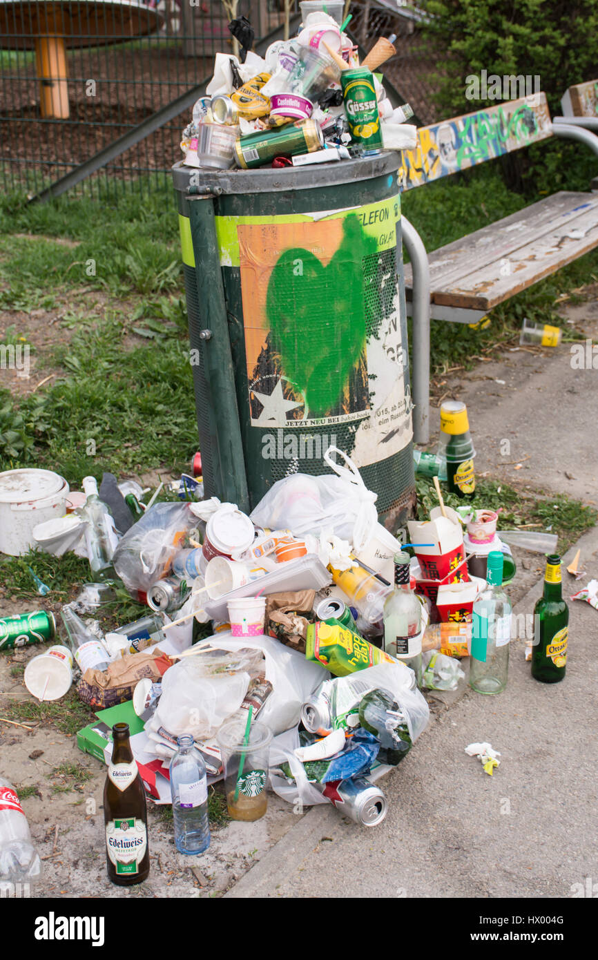 Full garbage can at the banks of the Danube canal, Vienna, Austria, Europe Stock Photo
