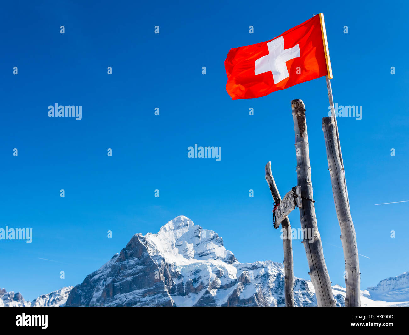 Switzerland, Canton of Bern, Grindelwald, Swiss flag in the mountains Stock Photo