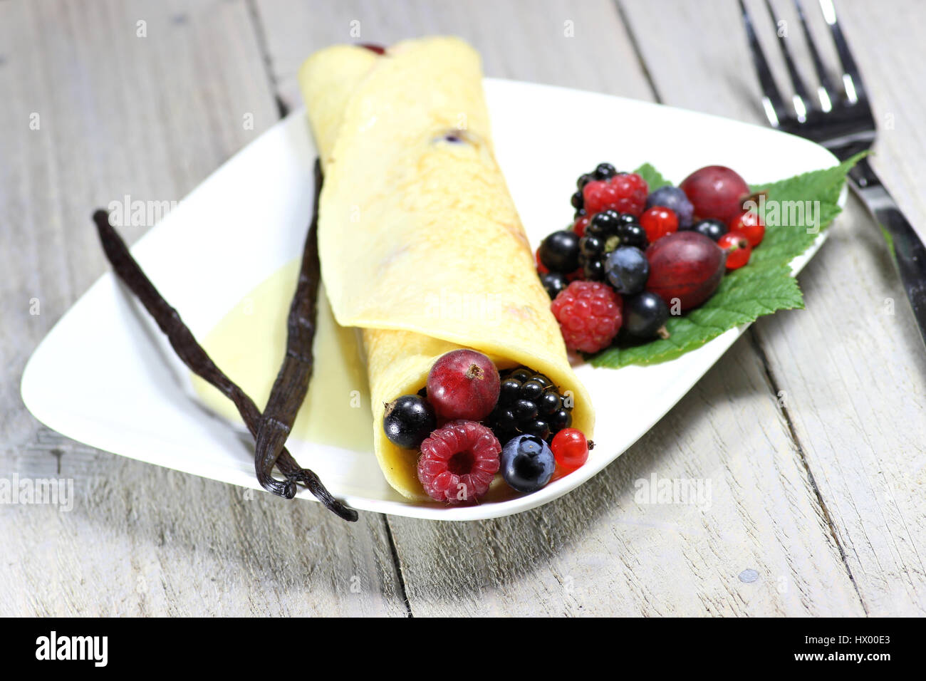 pancake with garden berries and custard sauce Stock Photo Alamy
