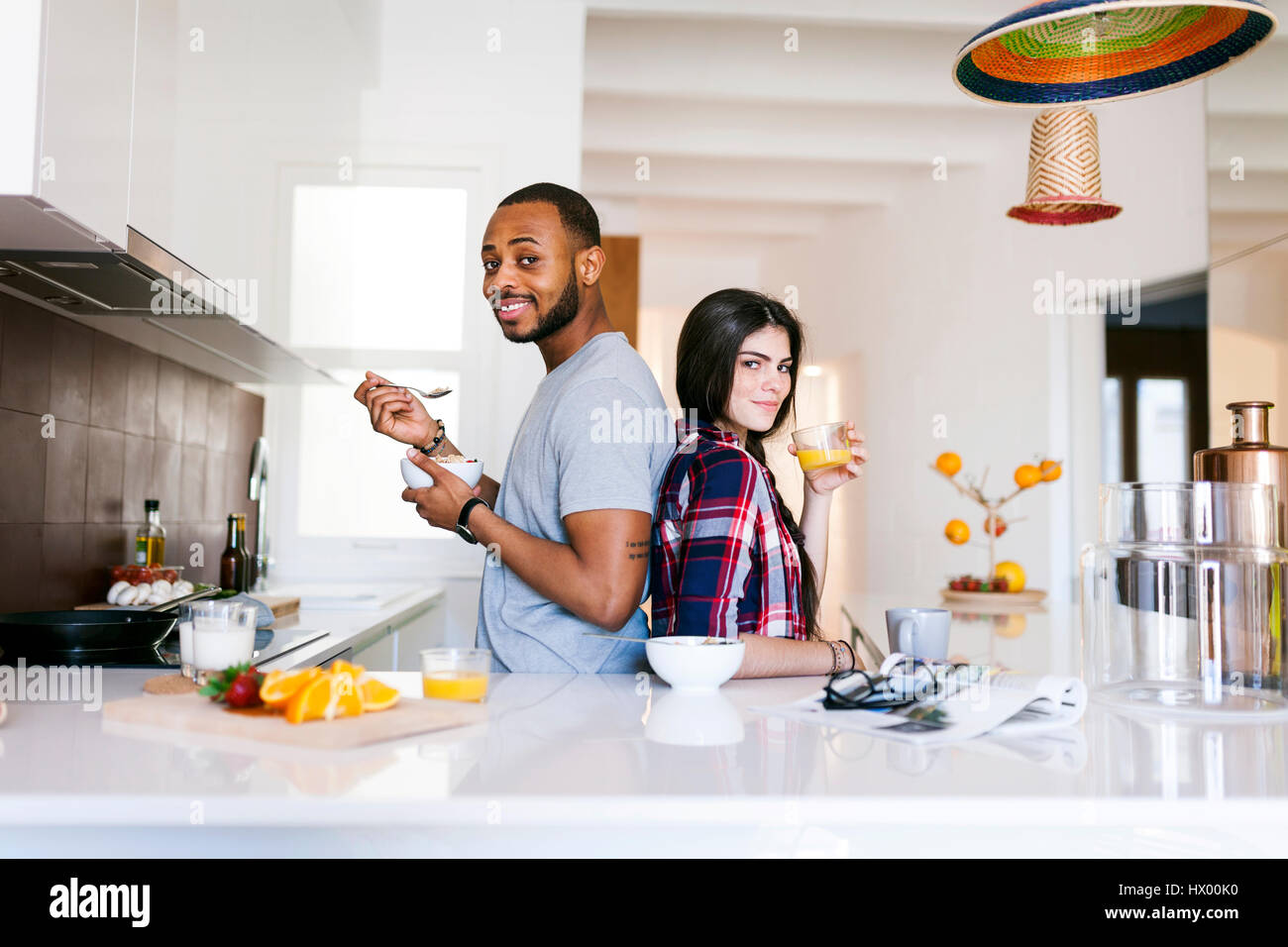 Interracial couple kitchen standing hi-res stock photography and images ...