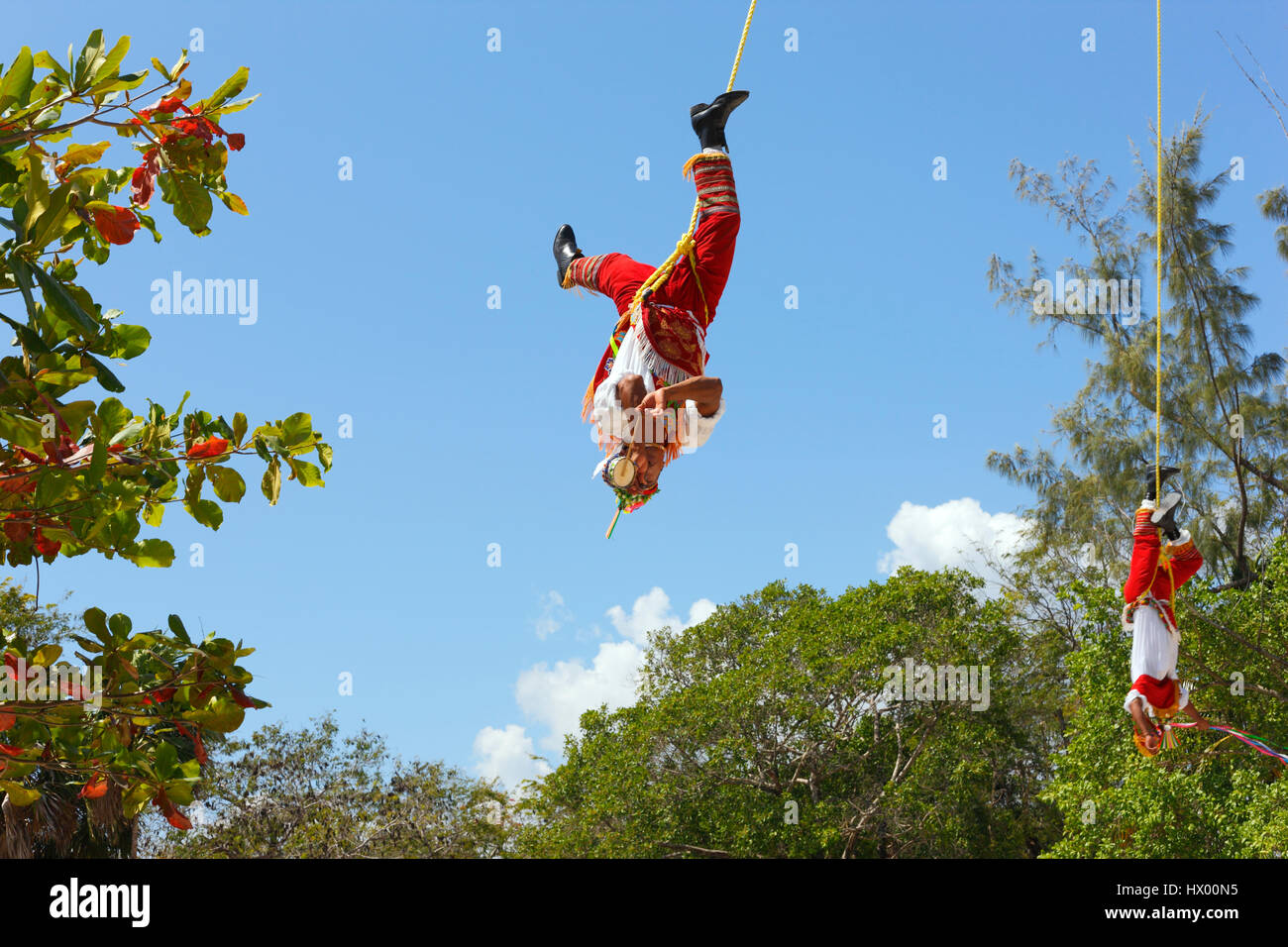 Papantla Flying Men Flying man in Tulum, Mexico Stock Photo