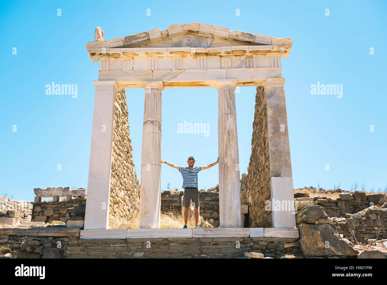 Greece, Mykonos, Delos, tourist visiting the Temple of Isis Stock Photo