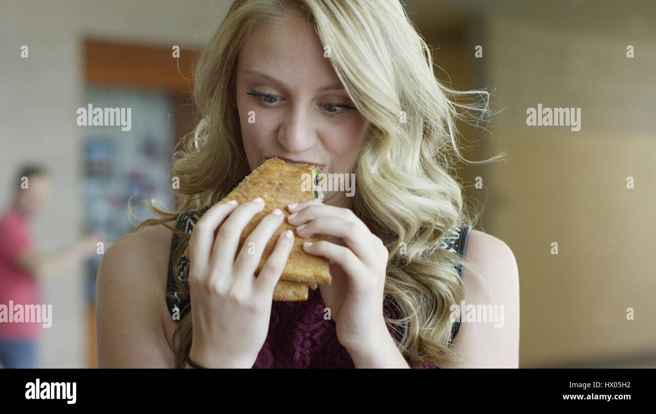 Close up of hungry woman eating delicious pizza Stock Photo