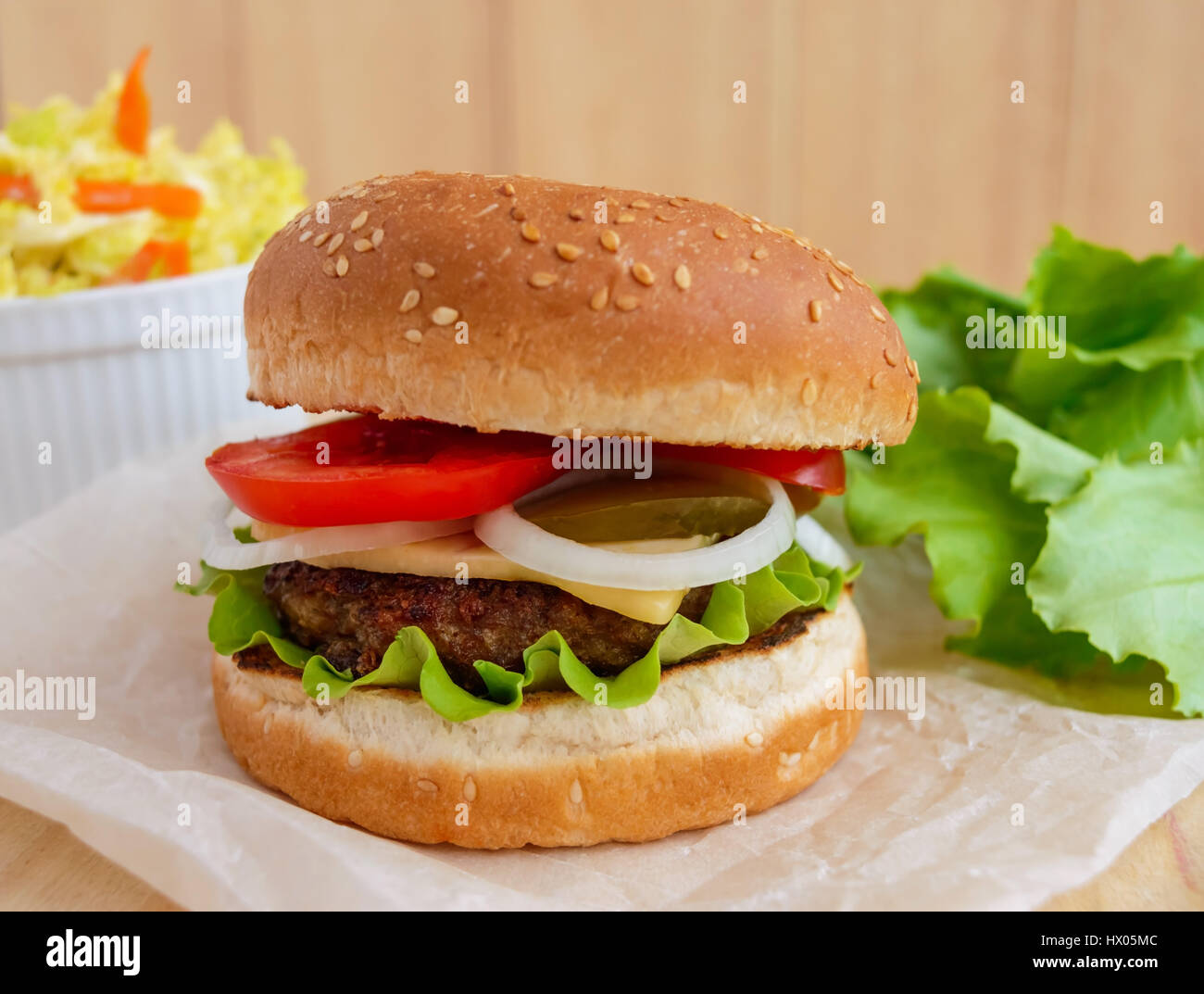 Sandwich home of the hamburger buns soft, juicy burger, cheese, tomato, parsley. Salad savoy