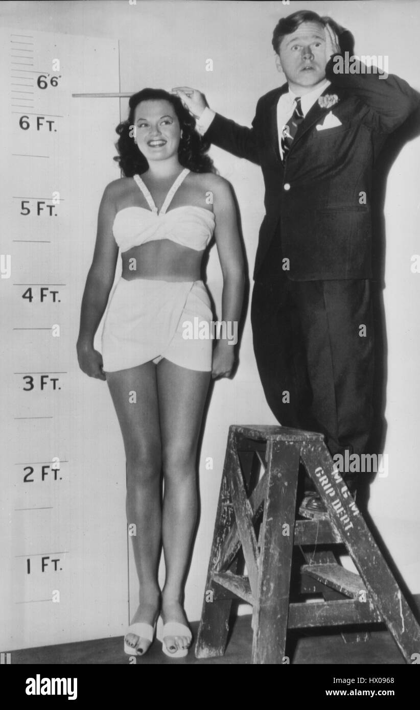 Mickey Rooney Measuring Height of Dorothy Ford, Promotional Portrait for the Film, 'Uncle Andy Hardy' (aka Love Laughs at Andy Hardy), MGM, 1946 Stock Photo