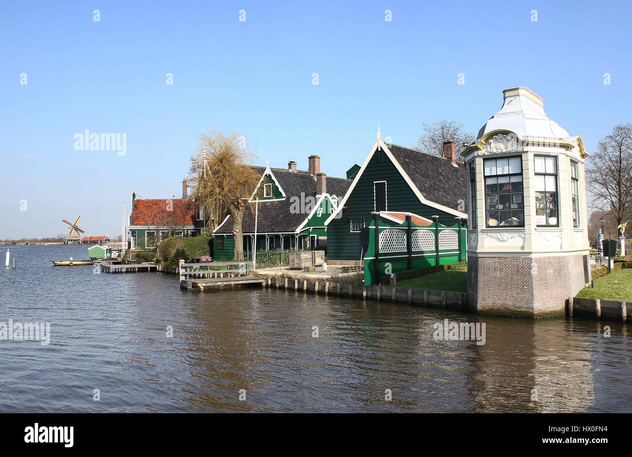 Traditional Dutch wooden houses and historical windmills at the village of Zaanse Schans, Zaandam / Zaandijk, Netherlands Stock Photo