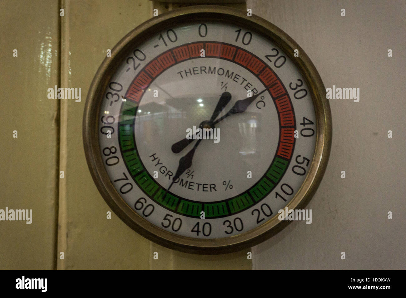 Vintage thermometer and hygrometer hanging on the wall photo taken in Pekalongan Indonesia Stock Photo