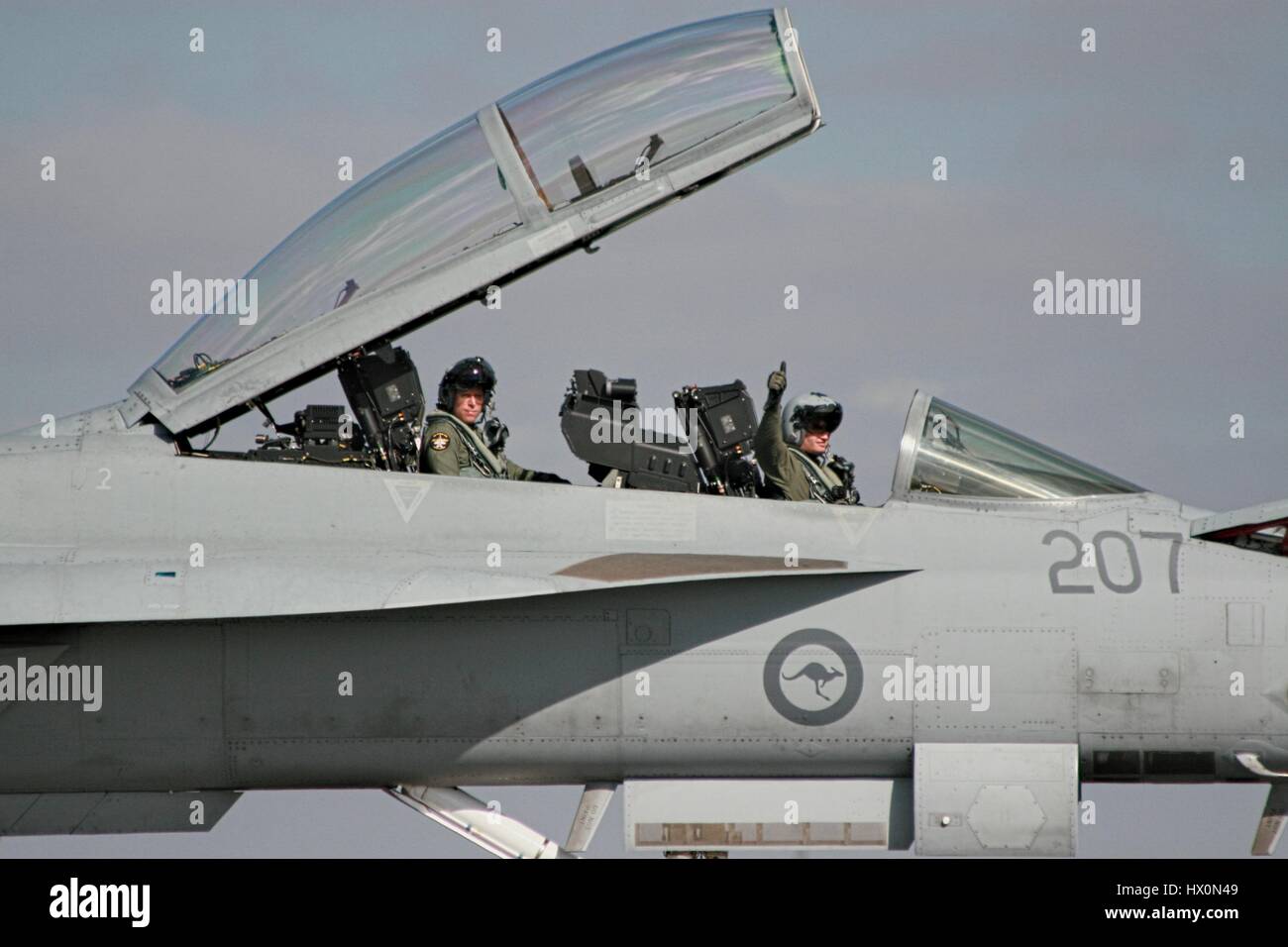 F/A-18F Super Hornet on the runway at Avalon airshow, Australia, canopy open, pilots giving thumbs up. Stock Photo