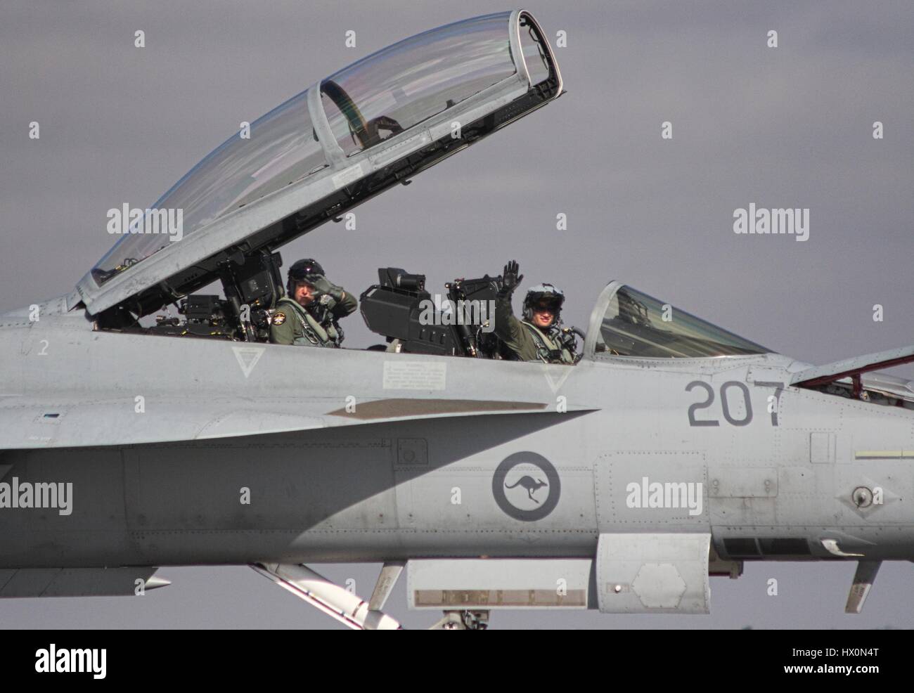 F/A-18F Super Hornet on the runway at Avalon airshow, Australia, canopy open, pilots waving. Stock Photo