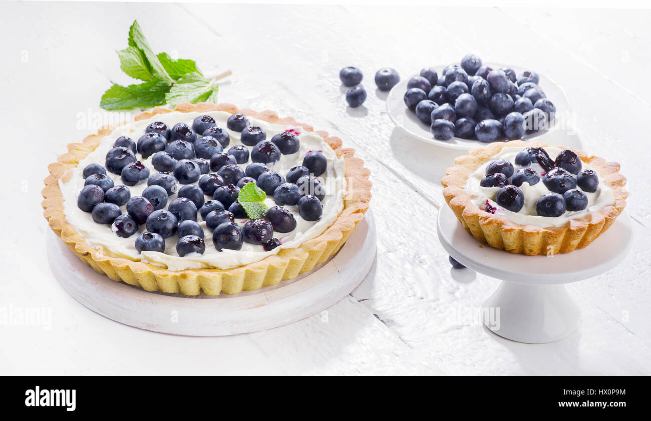 Sweet Cakes with blueberries, mint and whipped cream Stock Photo - Alamy