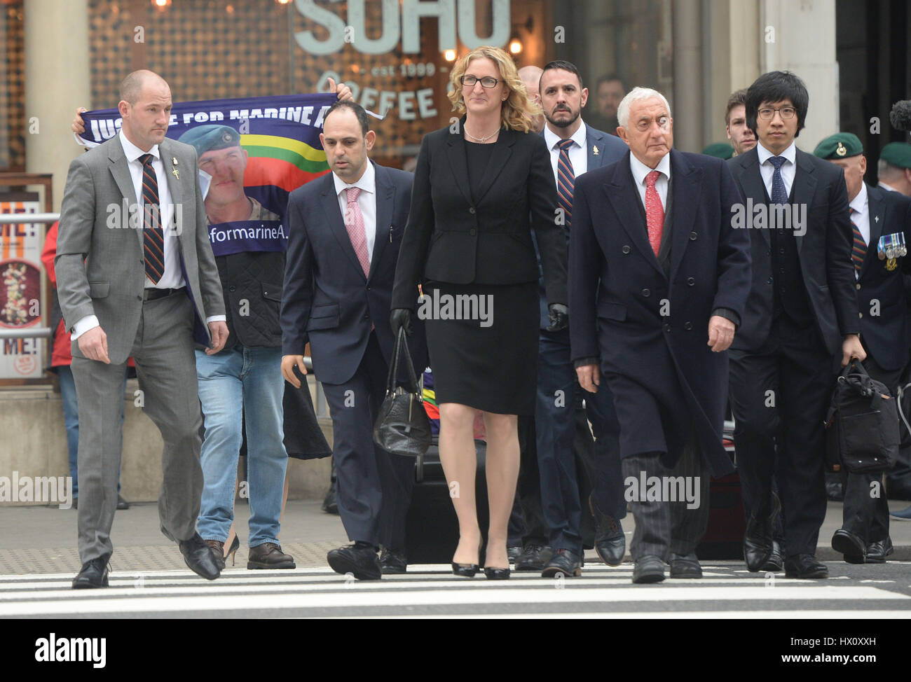 Claire Blackman (centre), the wife of Alexander Blackman, and his barrister Jonathan Goldberg QC (second right) outside the Royal Courts of Justice before the sentencing of the Royal Marine for diminished responsibility manslaughter, after his murder conviction was quashed by leading judges for shooting an injured Taliban fighter in Afghanistan. Stock Photo
