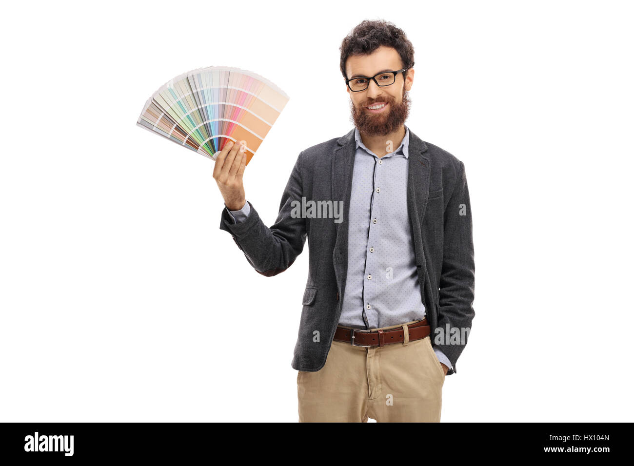 Bearded young man holding a color swatch isolated on white background Stock Photo