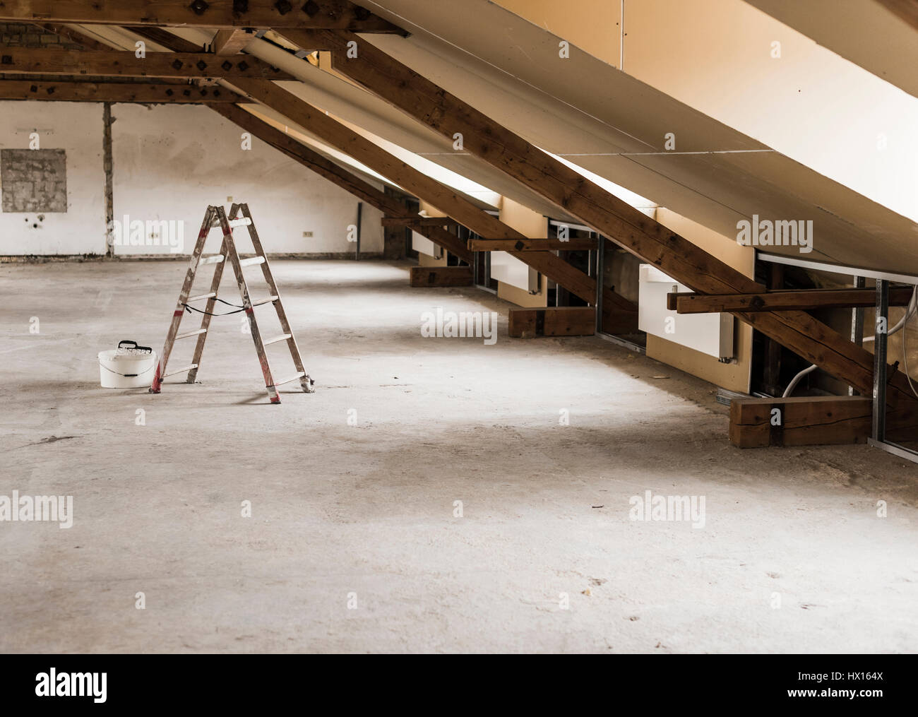 Ladder and paind bucket on construction site Stock Photo Alamy