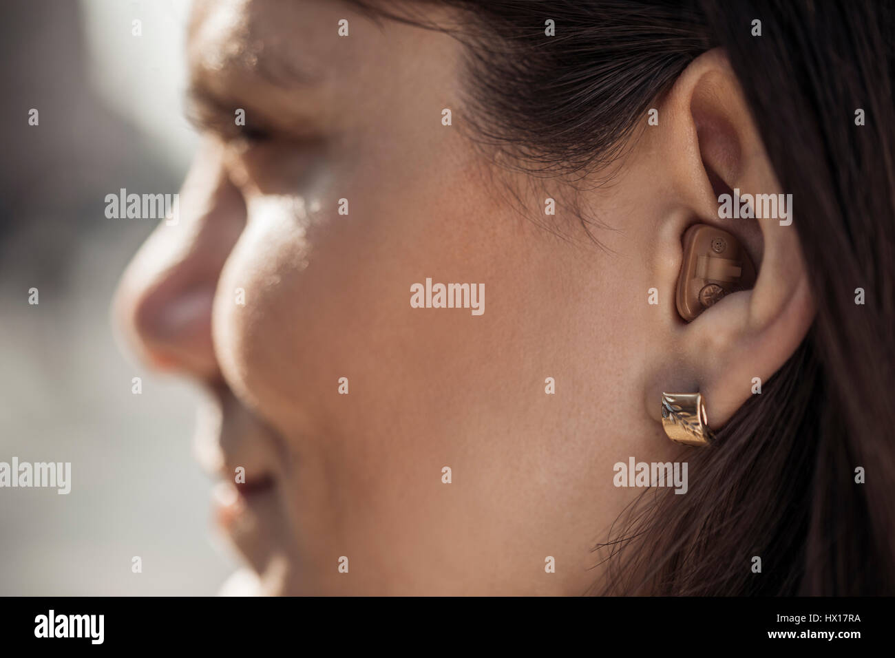 Young woman with hearing aid, close-up Stock Photo