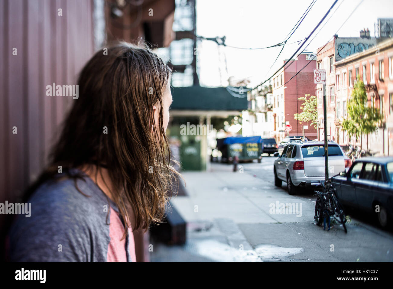 USA, New York City, man looking around in Williamsburg, Brooklyn Stock