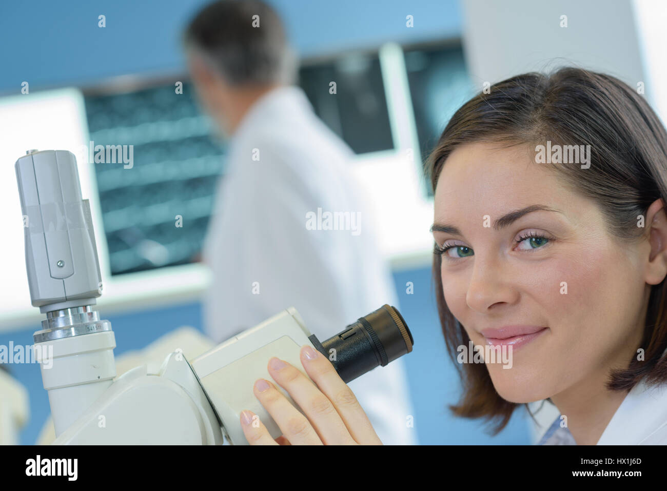 worker and microscope Stock Photo Alamy