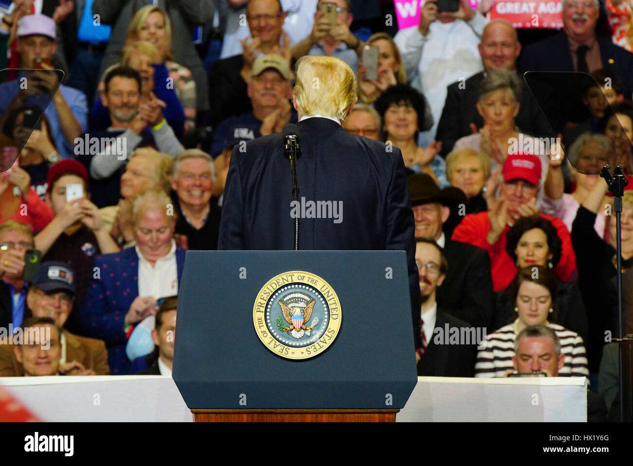 President Donald J Trump facing supporters behind him during a rally at ...