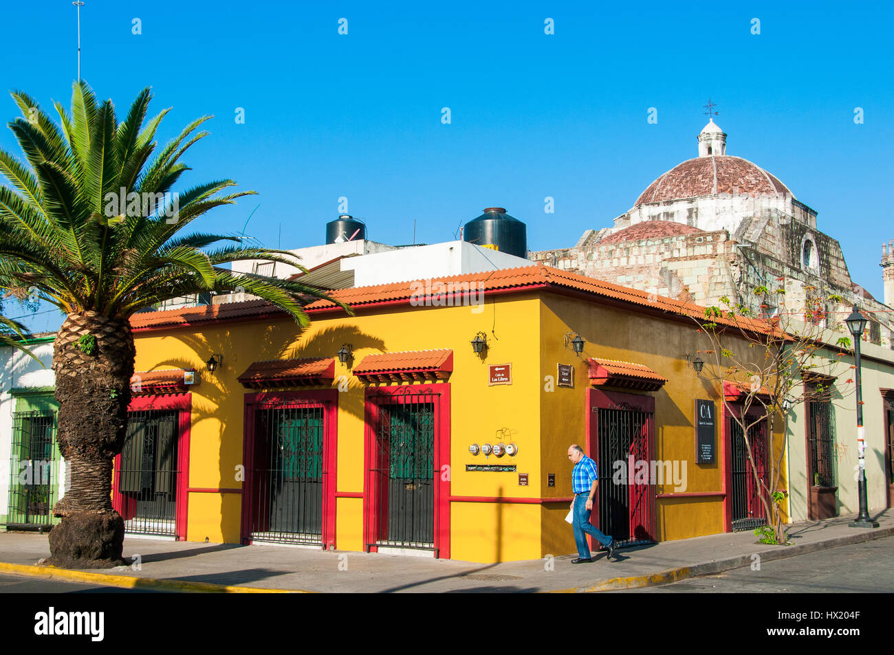 street with colonial houses in the historic city center of Oaxaca, Mexico Stock Photo