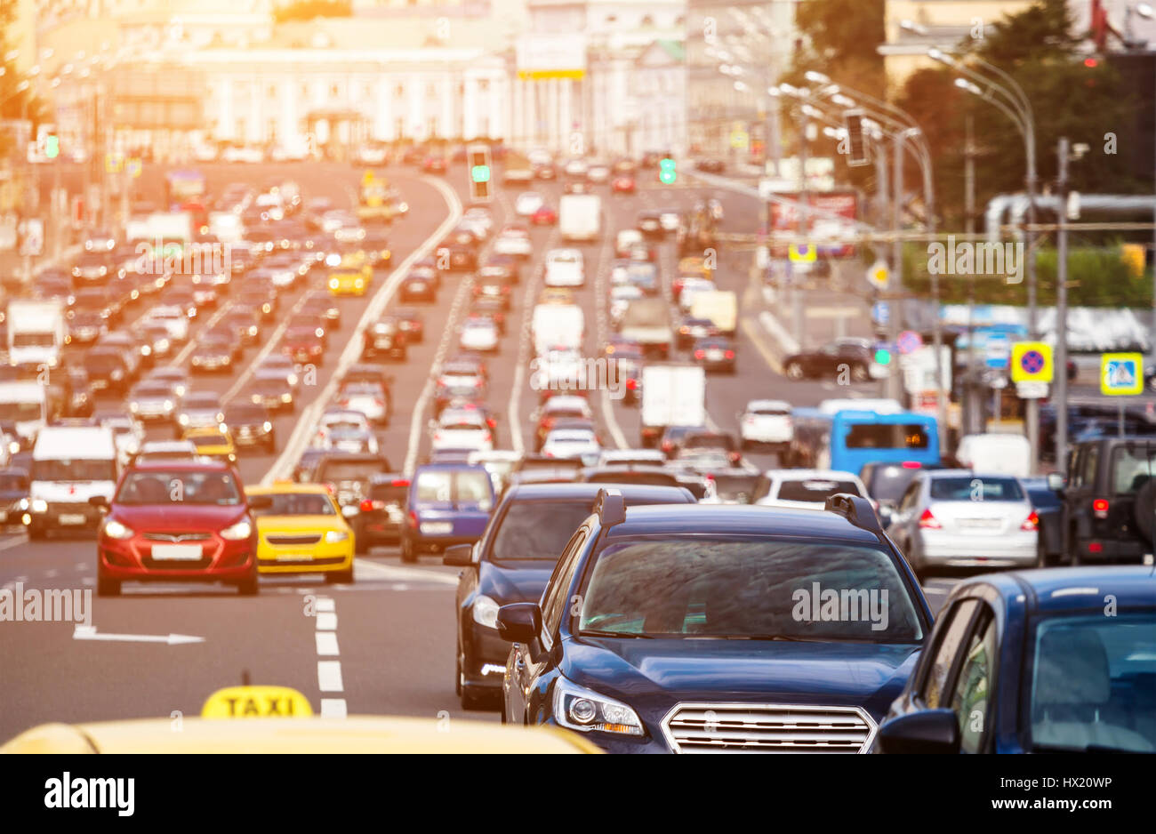 Rush hour on the city highway with warm sunlight Stock Photo - Alamy