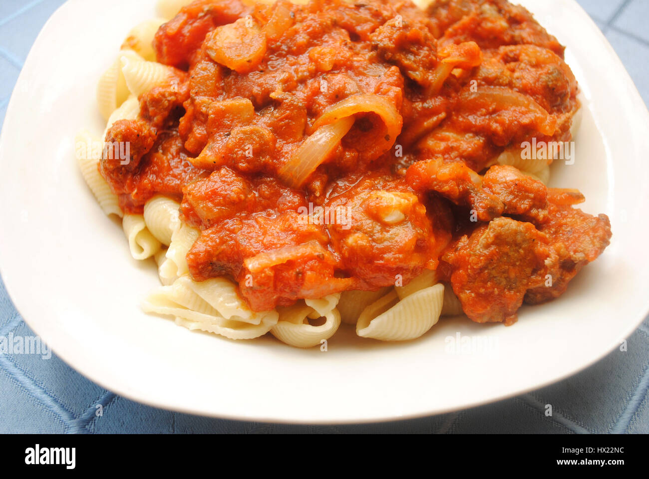 Pasta Shells Served with Chunky Meat Sauce Stock Photo - Alamy