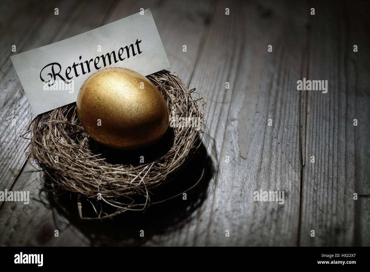 Golden nest egg concept for retirement savings Stock Photo