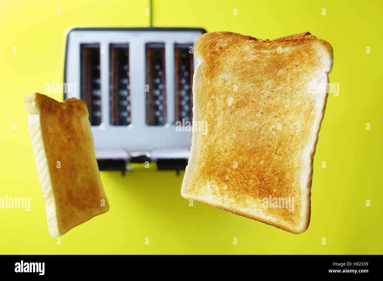toast or toasted bread popping up from the toaster Stock Photo