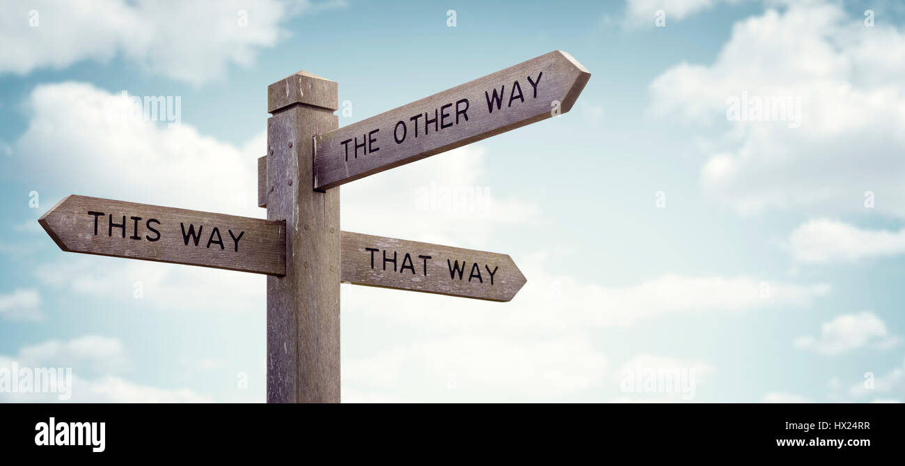 Crossroad signpost saying this way, that way, the other way concept for lost, confusion or decisions Stock Photo