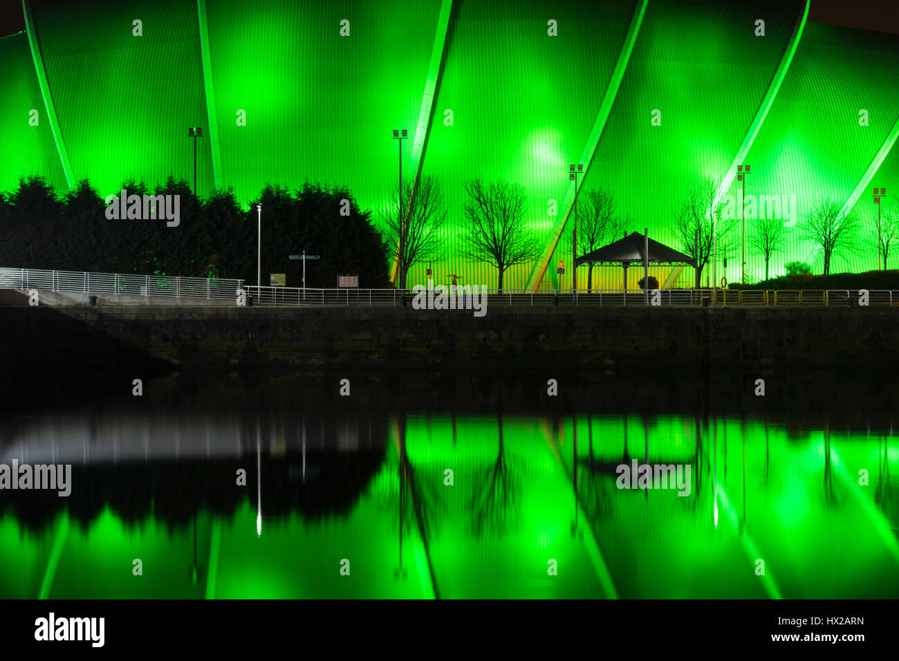 The SEC Armadillo music venue at the Scottish Event Campus, Glasgow, Scotland, UK - reflected in the River Clyde at night Stock Photo