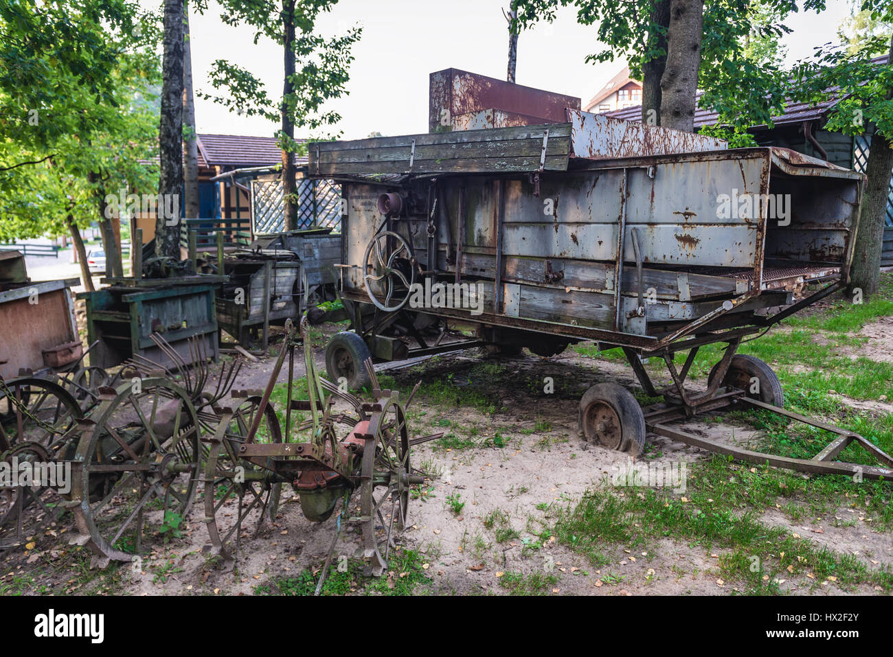 Old farming machine in Centre for Education and Regional Promotion in Szymbark village, Kashubia region of Pomeranian Voivodeship in Poland Stock Photo