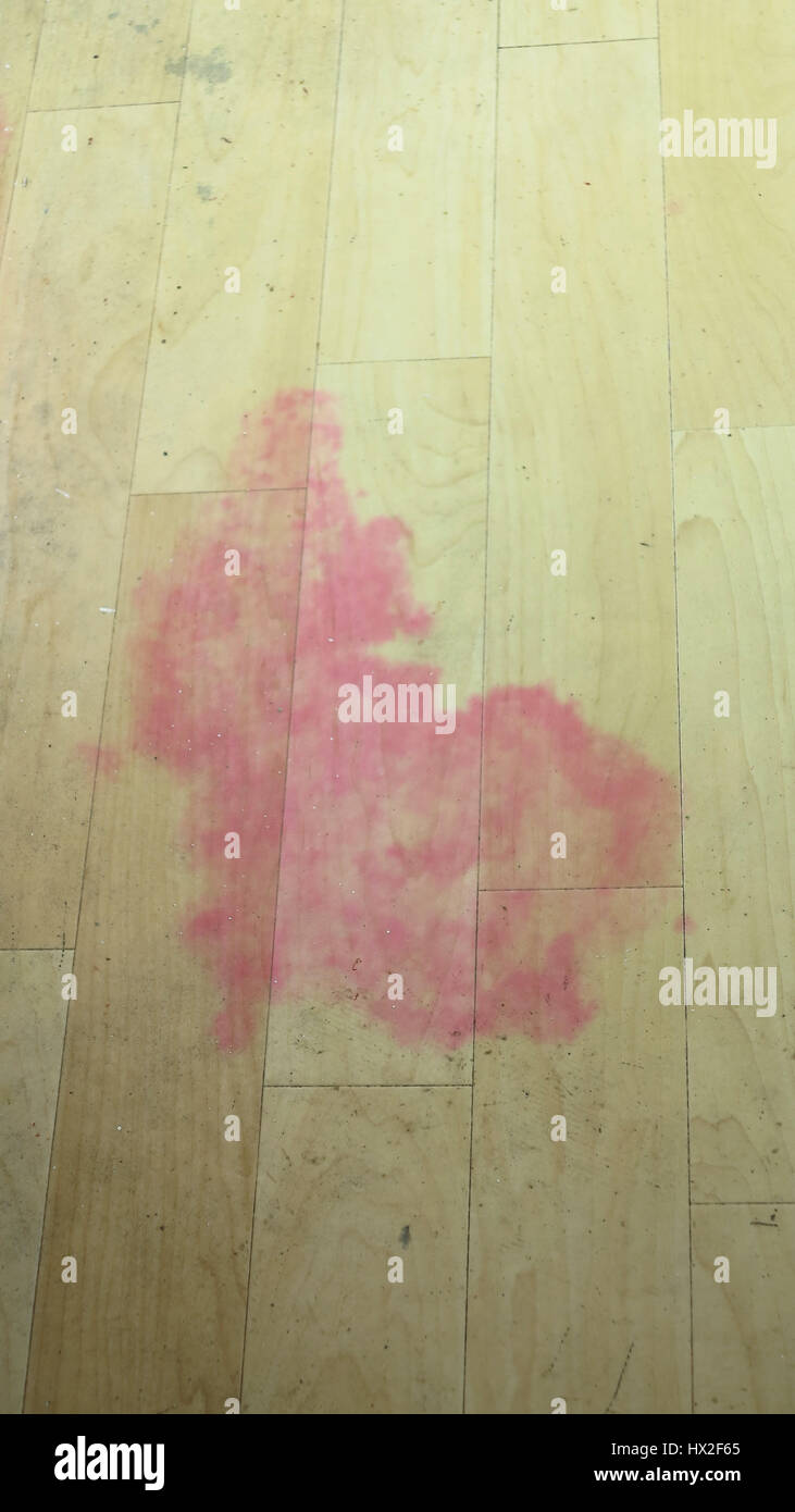 Pink stain caused by mould on vinyl flooring Stock Photo