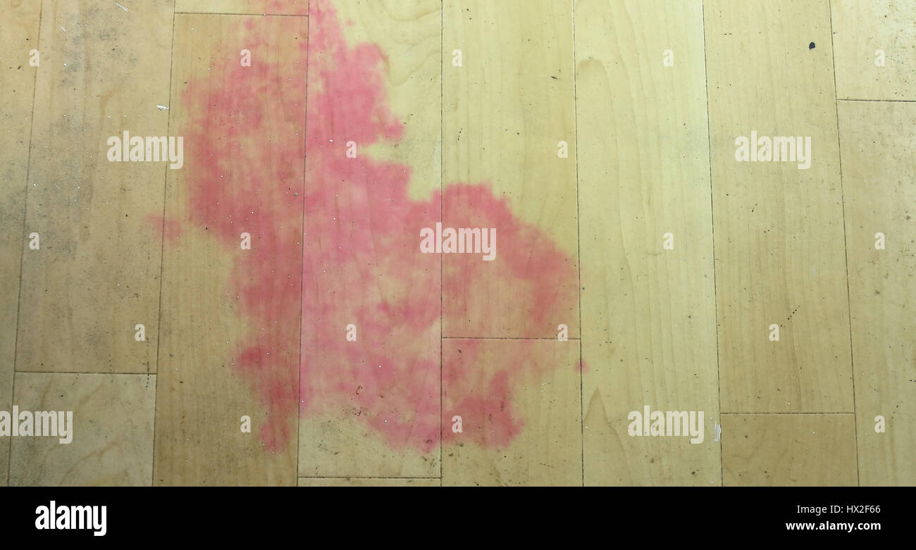 Pink stain caused by mould on vinyl flooring Stock Photo