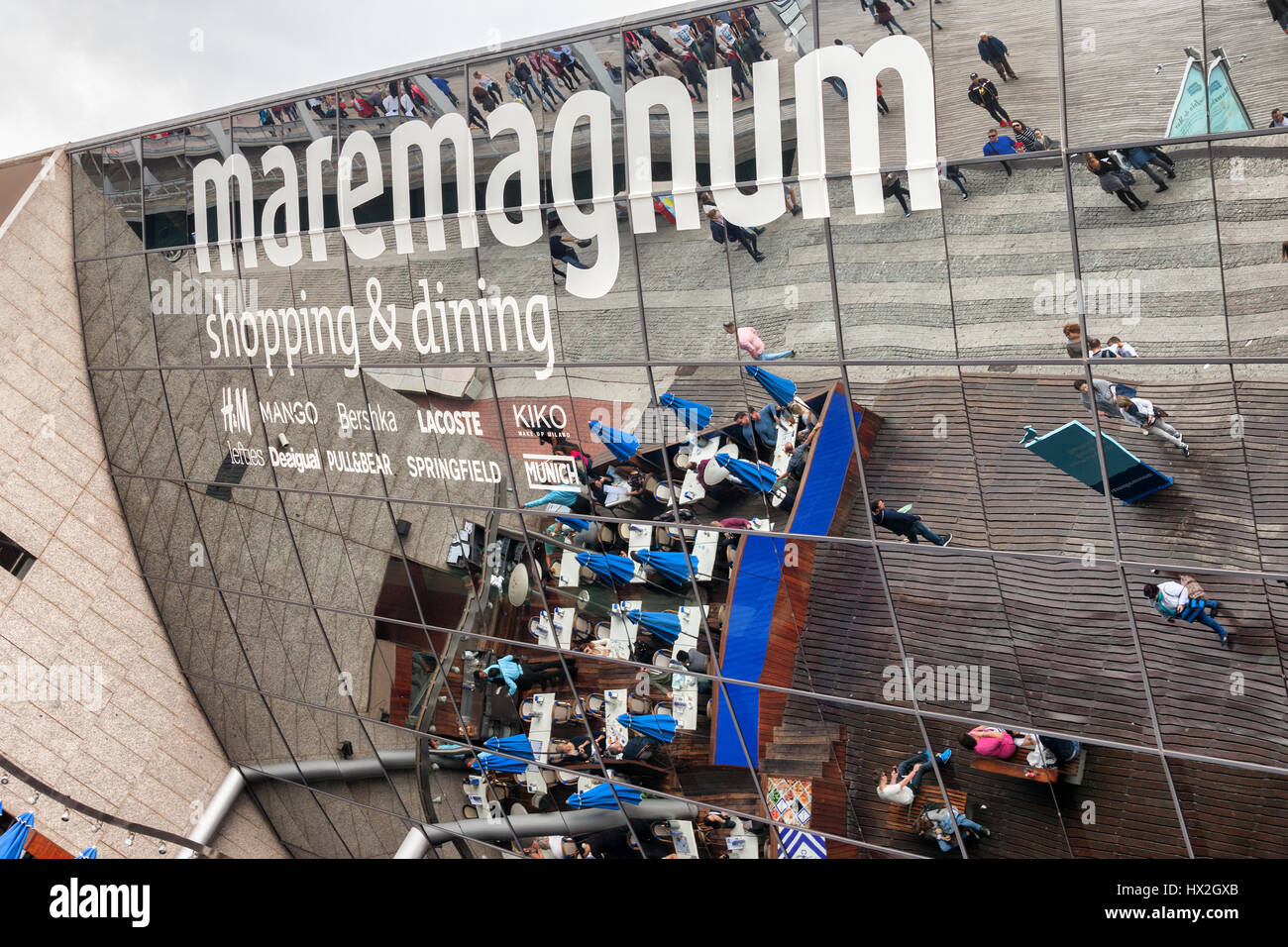Spain, city of Barcelona, Maremagnum Shopping Centre, restaurant tables and  people on glass facade reflection Stock Photo - Alamy