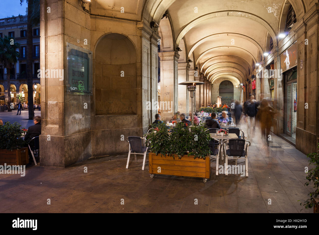 Arched arcade of Placa Reial in Barcelona at night, Royal Square in historic city centre, Barri Gotic quarter, Catalonia, Spain Stock Photo