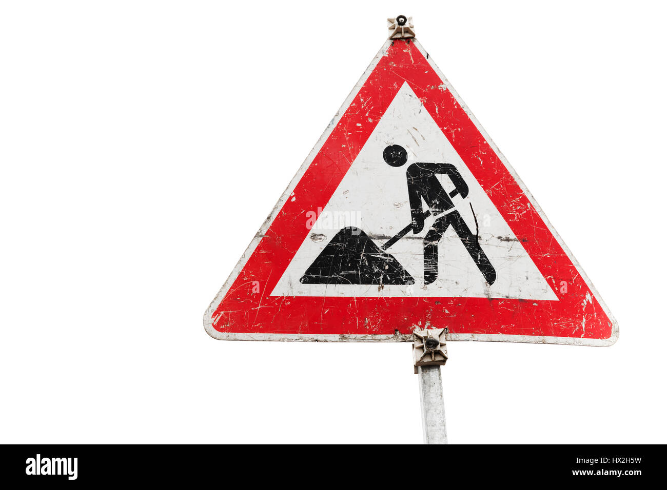 Roadworks, under construction, men at works. Triangle road sign isolated on white background, close up photo Stock Photo