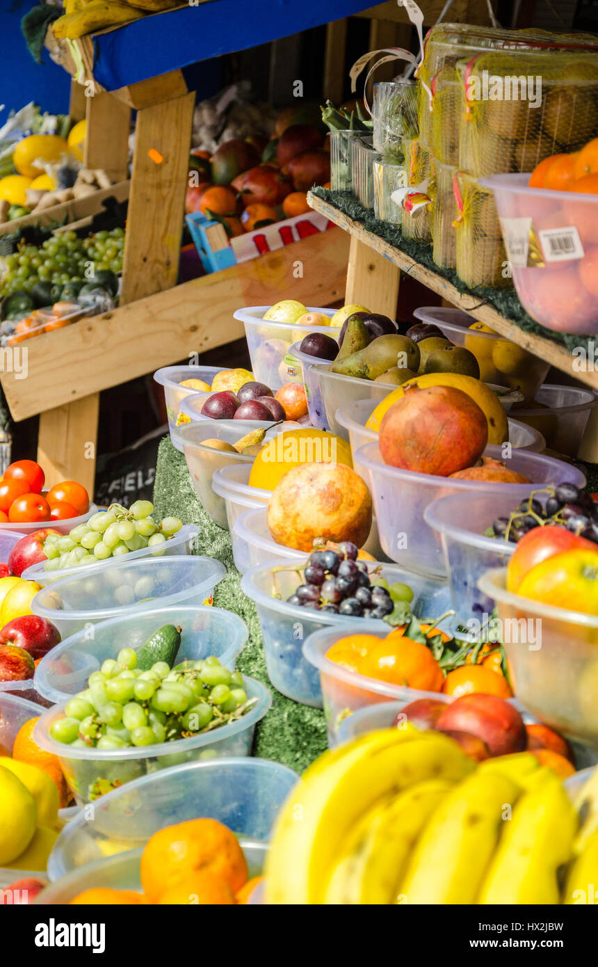 A display of fruit and vegetables for sale outside a greengrocer's shop Stock Photo