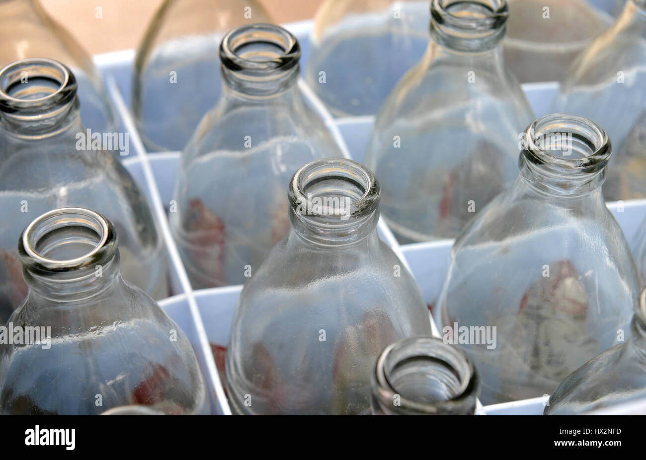 Empty soda glass bottles after use for recycle or reuse photo in