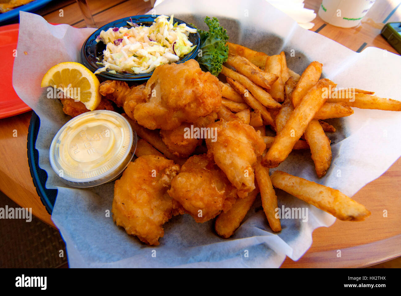 deep fried fish diner with fries and sauce Stock Photo Alamy
