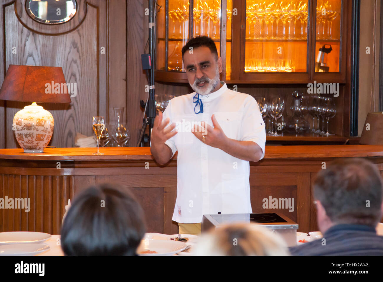'Use salt and passion!' Vineet Bhatia is also fully committed to the cooking demonstration. He explains very clearly the basic seasoning mechanisms of Indian cuisine Stock Photo