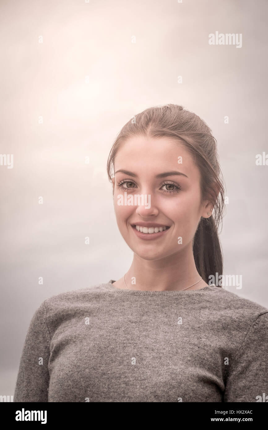 A natural head and shoulders portrait of a teenage girl Stock Photo - Alamy