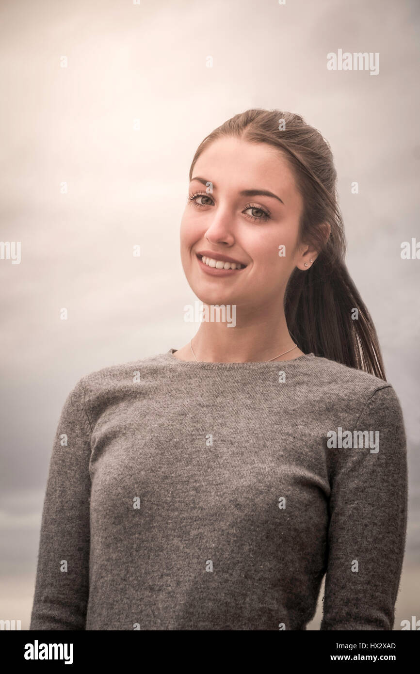 A natural head and shoulders portrait of a teenage girl. Stock Photo