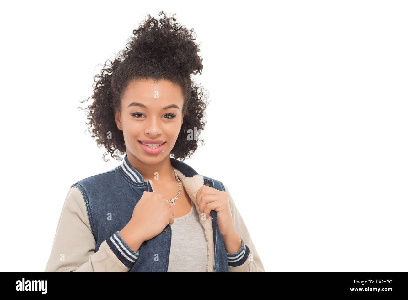 Teenage model with urban fashion clothes isolated on a white background