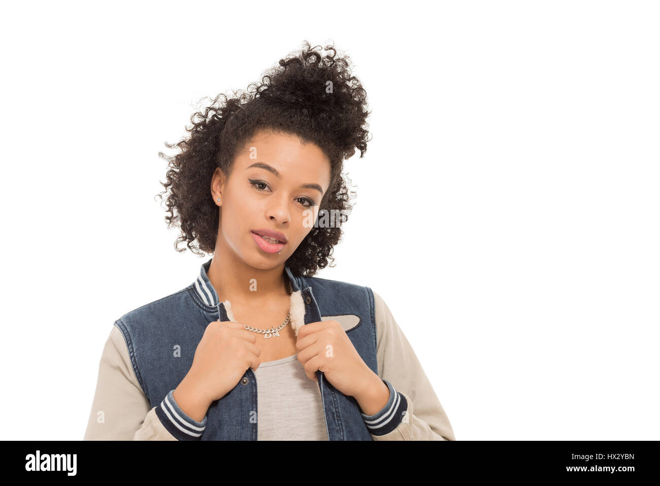 Teenage model with urban fashion clothes isolated on a white background