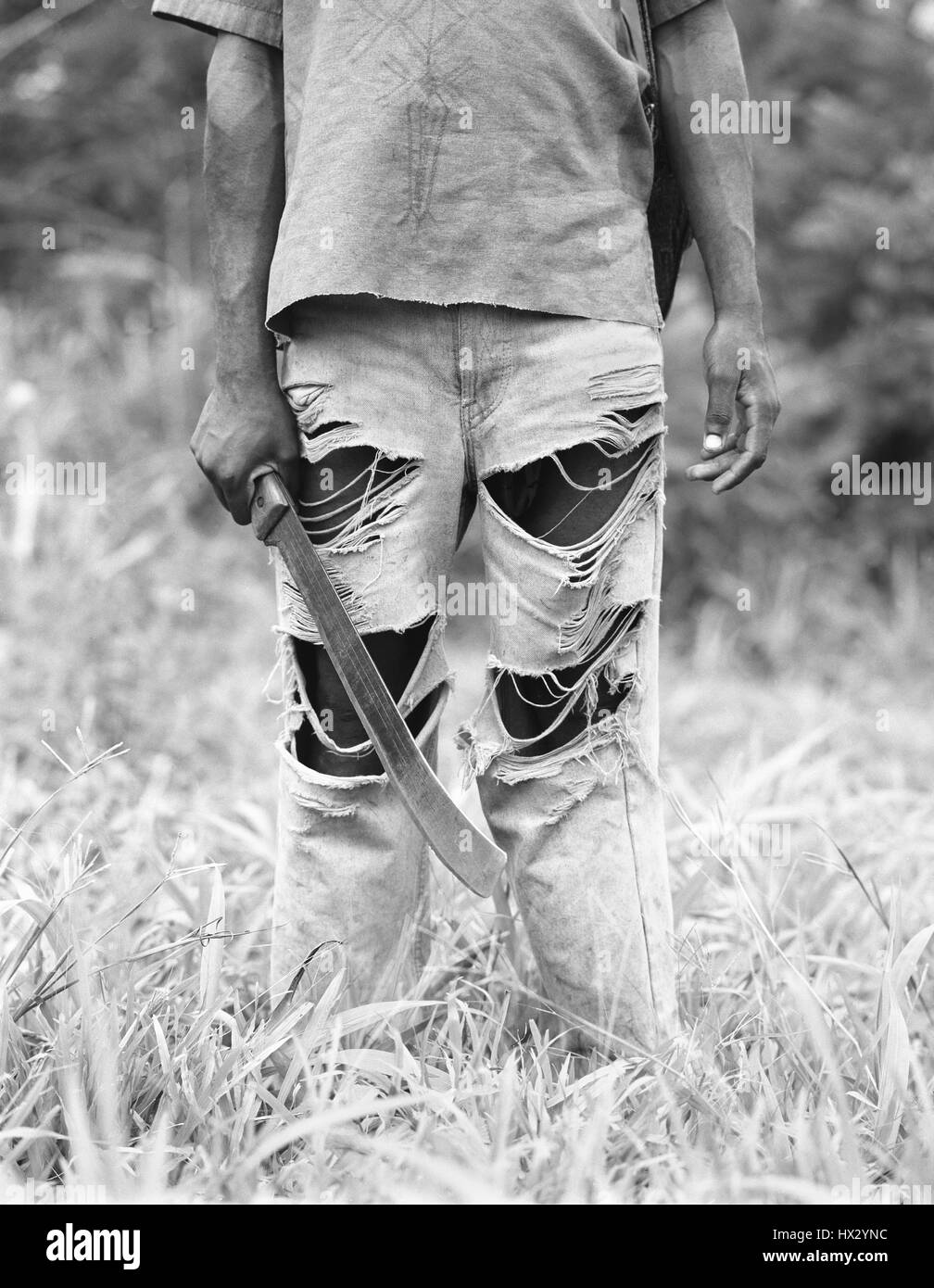 Field worker carrying machete,  Cameroon,  Africa Stock Photo