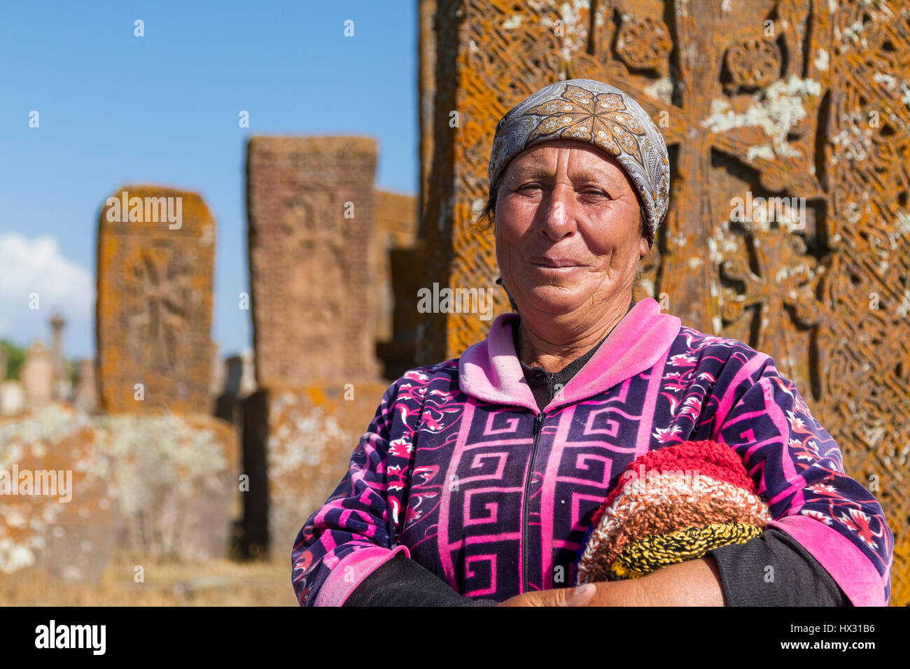 Armenian woman in the historical cemetery of Noraduz in Armenia. Stock Photo