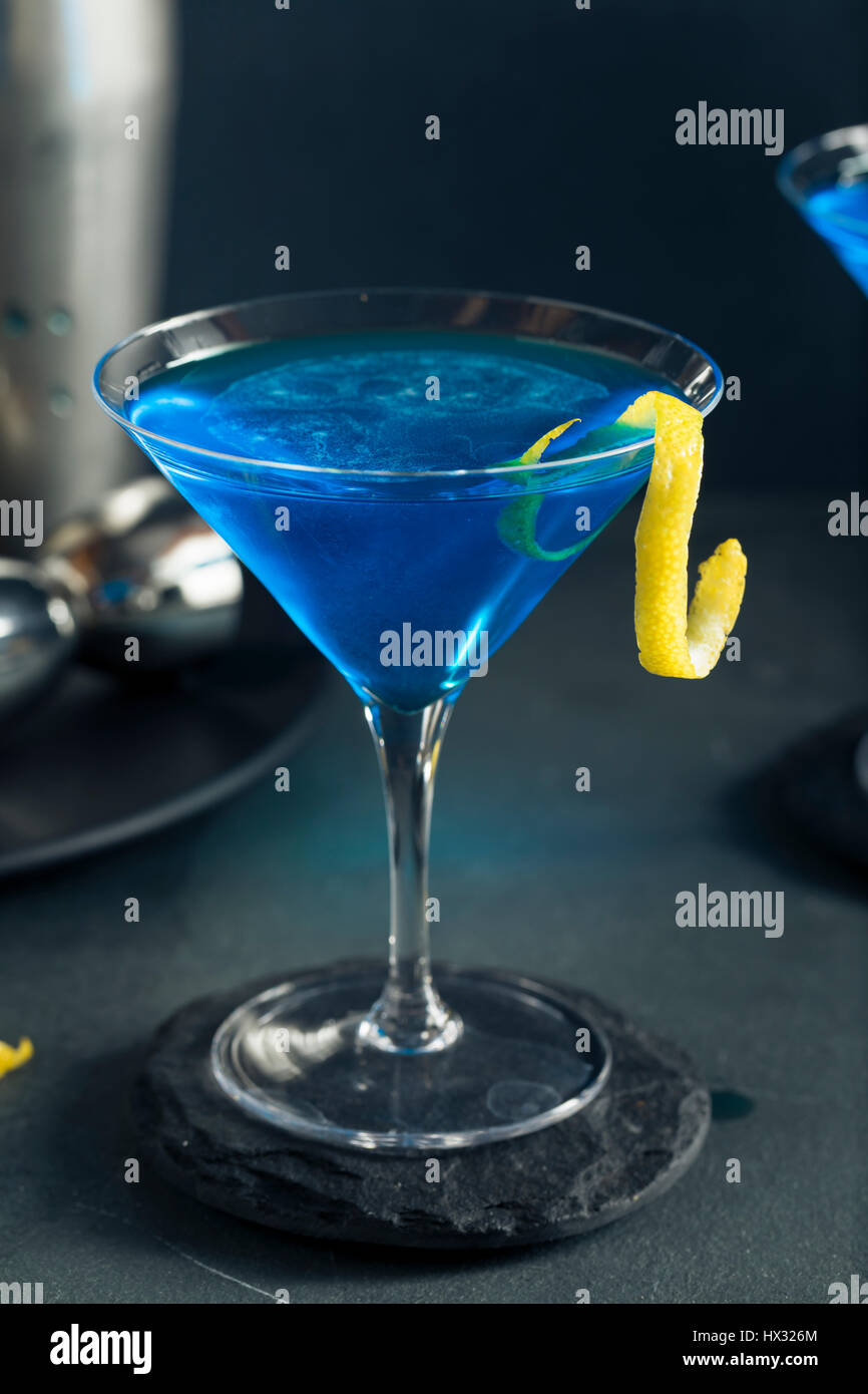 Refreshing Blue Martini Cocktail with Lemon Garnish Stock Photo