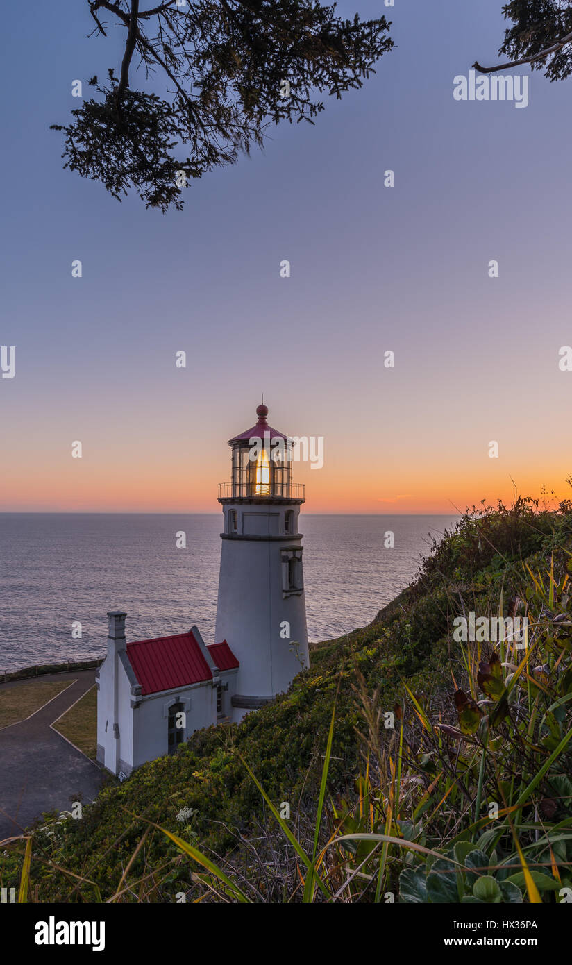 Heceta Head Lighthouse at sunset Stock Photo
